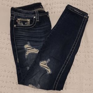 Distressed dark wash skinny jeans
